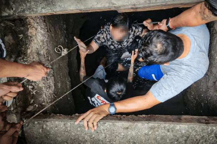 Woman in Thailand falls 2m after manhole cover gives way, trapped underground for half an hour